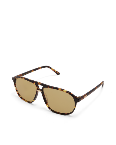 Women's aviator sunglasses in amber tort colourway featuring an oversized modified aviator silhouette with flat-top brow bar, double bridge, angular navigator-inspired shaping, and slim arms for a bold, contemporary look with full coverage.
