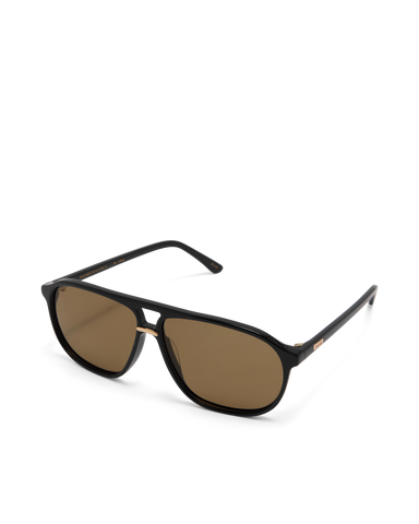 Oversized women's aviator sunglasses with a, flat-top brow bar, keyhole cut, double bridge, and slim arms.