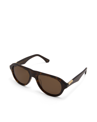 Oversized tortoiseshell aviator frame, designed with a bold, architectural silhouette that blends vintage influence with a modern edge.